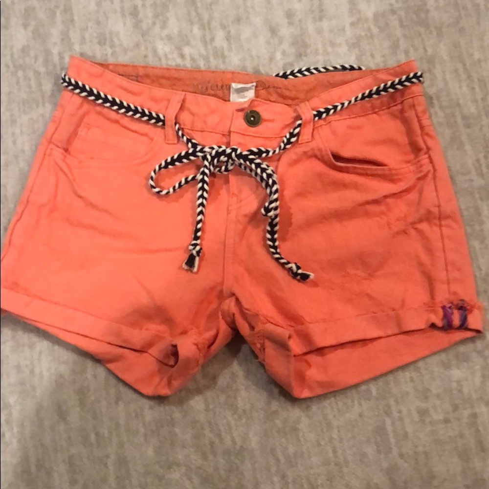 Orange pinkish colored women’s shorts